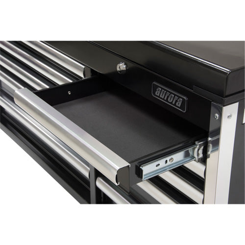 Tiroir ouvert d’un coffre à outils industriel noir avec poignée métallique et intérieur vide.