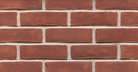 Mur de briques rouges avec joints de mortier gris clair